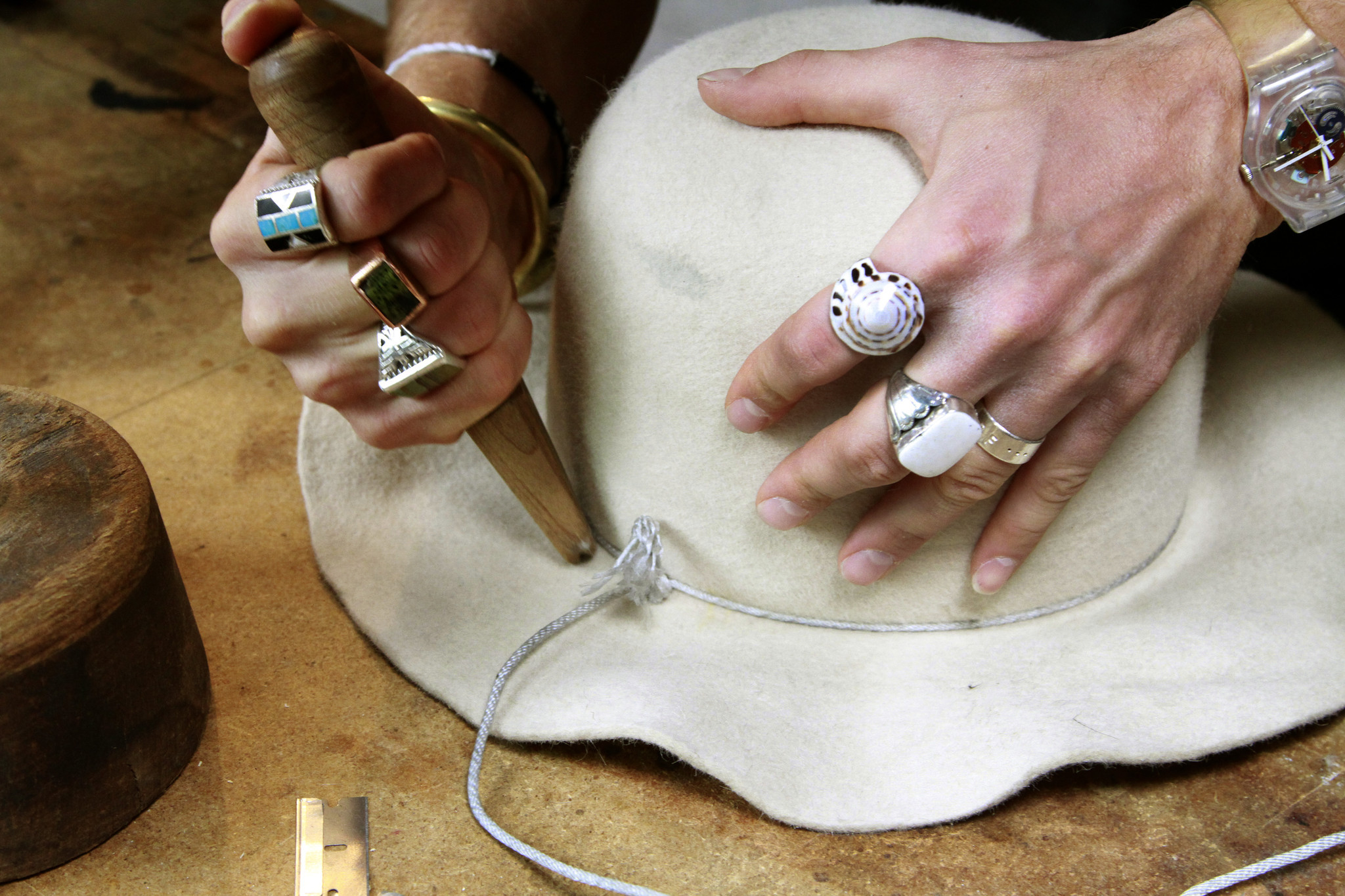 LOS ANGELES, CA., April 17, 2014 : Nick Fouquet (a model for Ralph Lauren, Guess, Hogan etc.) handcrafts hats in Venice; his hats have been featured in ad campaigns for companies such as Ralph Lauren label Denim & Supply, Free People and worn by celebs like Madonna, Jared Leto and Pharrell Williams. Hat maker Nick Fouquet's hands stretch felt over a block creating the shaape of the hat. (Kirk McKoy / Los Angeles Times)