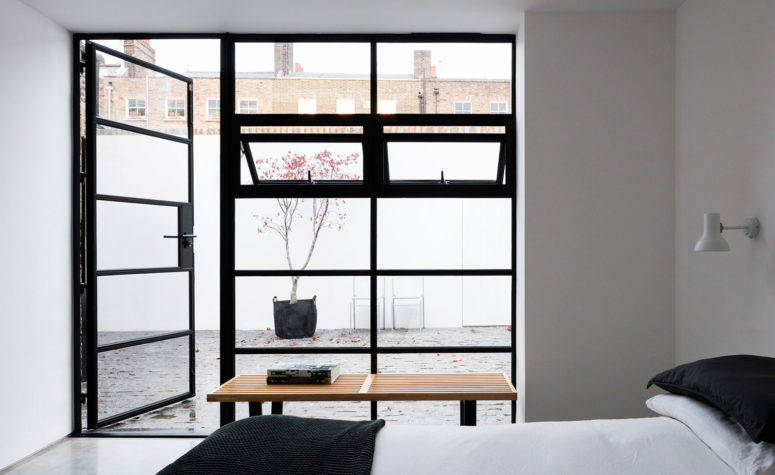 09-The-second-bedroom-is-connected-to-the-inner-courtyard-with-glass-doors-and-it-makes-it-super-inviting-775x475